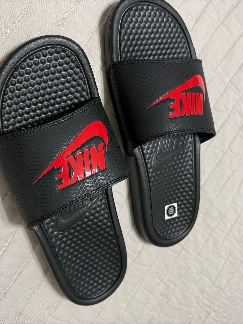Nike Black Slide Sandals with Red Swoosh